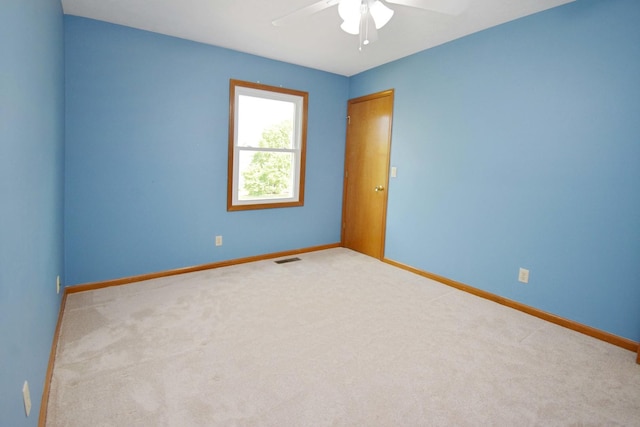 708 Wheeler Dr, Hudson, IL 61748 - carpeted spare room featuring ceiling fan and baseboards
