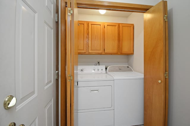 708 Wheeler Dr, Hudson, IL 61748 - laundry room featuring washer and dryer and cabinet space
