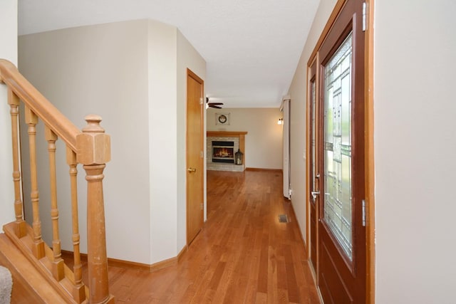 708 Wheeler Dr, Hudson, IL 61748 - hall featuring light wood finished floors and stairs