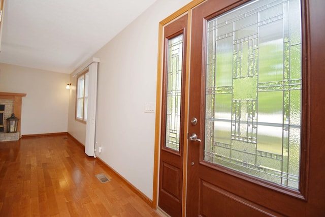 708 Wheeler Dr, Hudson, IL 61748 - entrance foyer featuring light wood-type flooring and baseboards