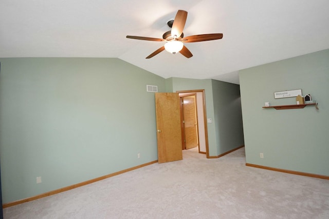 708 Wheeler Dr, Hudson, IL 61748 - carpeted spare room featuring ceiling fan and lofted ceiling