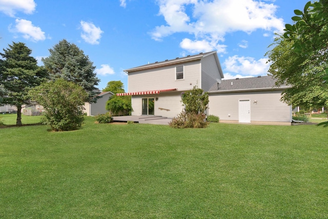 708 Wheeler Dr, Hudson, IL 61748 - back of property featuring a yard and a patio area