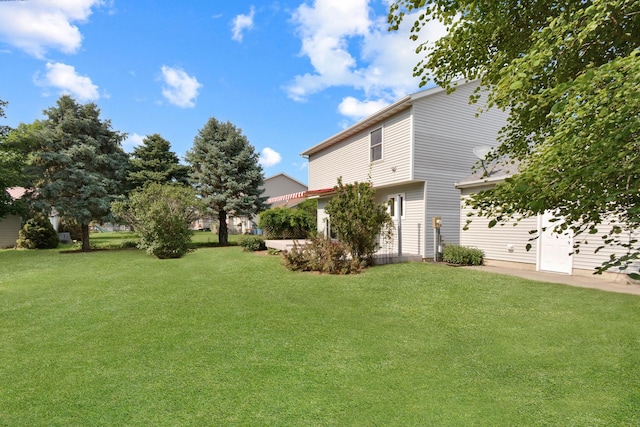 708 Wheeler Dr, Hudson, IL 61748 - view of grassy yard