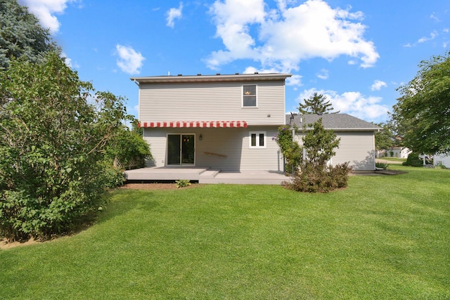 708 Wheeler Dr, Hudson, IL 61748 - rear view of property with a lawn, a patio area, and a wooden deck
