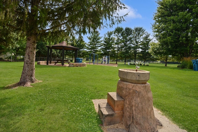 708 Wheeler Dr, Hudson, IL 61748 - view of grassy yard featuring a gazebo