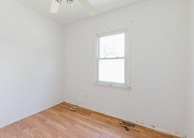 22118 E Churchill Dr, Richton Park, IL 60471 - empty room featuring healthy amount of natural light, light wood-type flooring, and a ceiling fan