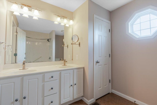 516 Wild Turkey Ln, Normal, IL 61761 - bathroom featuring double vanity and tile patterned floors