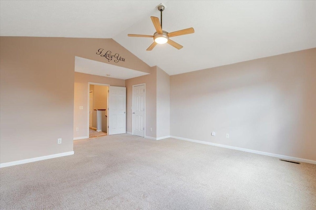 516 Wild Turkey Ln, Normal, IL 61761 - spare room with ceiling fan, lofted ceiling, and light carpet