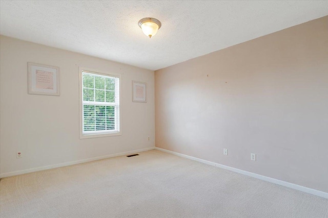 516 Wild Turkey Ln, Normal, IL 61761 - unfurnished room with light colored carpet and a textured ceiling