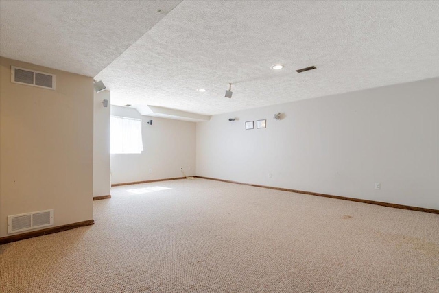516 Wild Turkey Ln, Normal, IL 61761 - carpeted empty room with a textured ceiling and recessed lighting