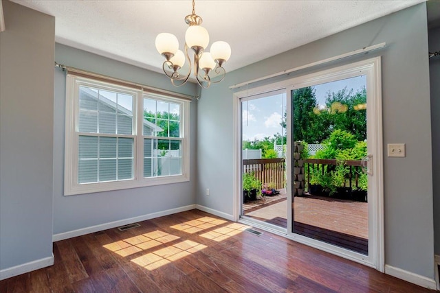 516 Wild Turkey Ln, Normal, IL 61761 - unfurnished dining area with a chandelier and wood finished floors