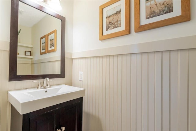516 Wild Turkey Ln, Normal, IL 61761 - bathroom featuring wainscoting and vanity