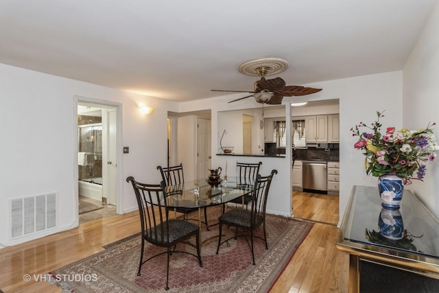 6229 N Niagara Ave Unit 209, Chicago, IL 60631 - dining room featuring light wood-type flooring and a ceiling fan