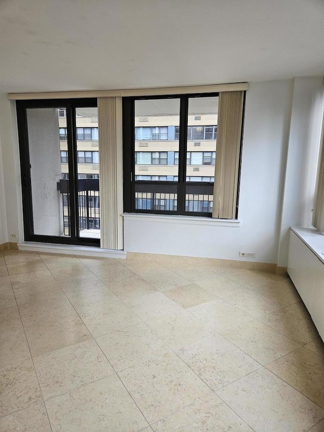 222 E Pearson St Unit 1801, Chicago, IL 60611 - spare room featuring tile patterned flooring