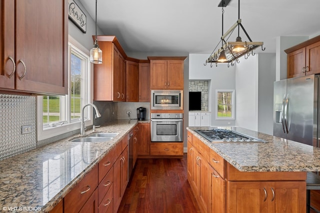 7271 Orchard Valley Dr, Bull Valley, IL 60050 - kitchen with stainless steel appliances, dark wood-style flooring, light stone countertops, decorative backsplash, and brown cabinetry