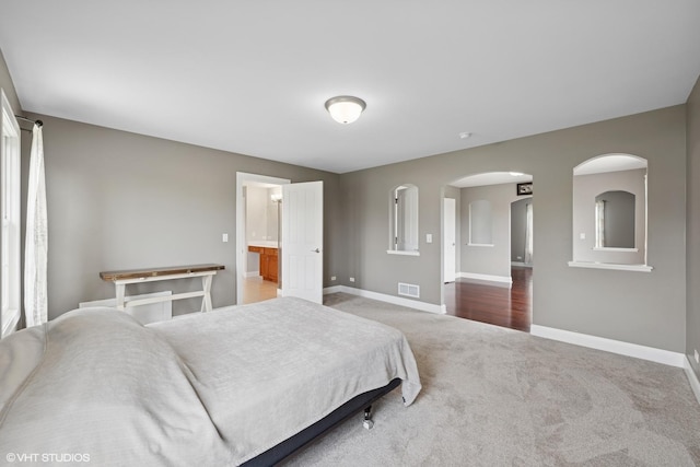 7271 Orchard Valley Dr, Bull Valley, IL 60050 - carpeted bedroom featuring baseboards and arched walkways