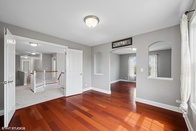 7271 Orchard Valley Dr, Bull Valley, IL 60050 - unfurnished room with arched walkways and wood finished floors