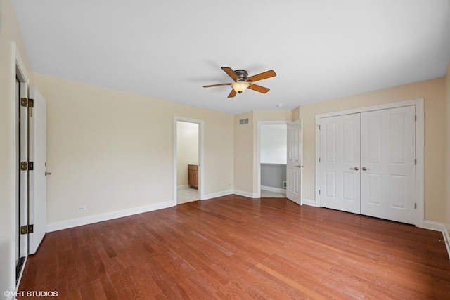 7271 Orchard Valley Dr, Bull Valley, IL 60050 - unfurnished bedroom with wood finished floors, a ceiling fan, and a closet