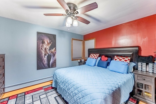 2418 S 58th Ave, Cicero, IL 60804 - bedroom with baseboard heating and a ceiling fan