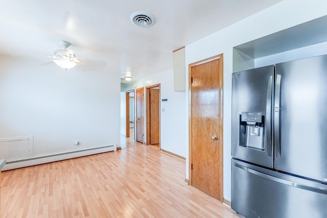 2418 S 58th Ave, Cicero, IL 60804 - kitchen with stainless steel fridge, a baseboard heating unit, light wood-style floors, and ceiling fan