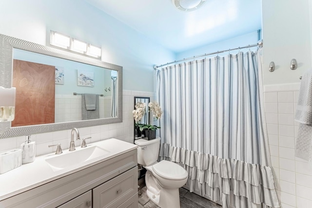 2418 S 58th Ave, Cicero, IL 60804 - bathroom with tile walls, vanity, curtained shower, and a wainscoted wall