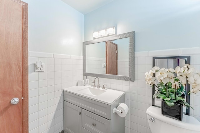 2418 S 58th Ave, Cicero, IL 60804 - bathroom with tile walls, vanity, and wainscoting
