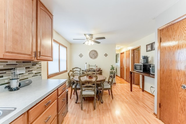 2418 S 58th Ave, Cicero, IL 60804 - dining room with light wood finished floors and ceiling fan
