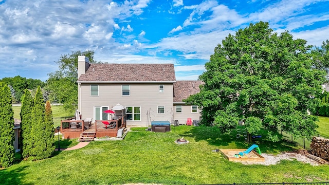 2020 Autumnwood Dr, Ottawa, IL 61350 - back of house featuring a jacuzzi, a deck, a yard, and a chimney