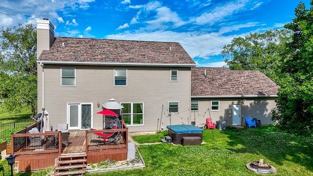 2020 Autumnwood Dr, Ottawa, IL 61350 - rear view of property featuring a hot tub, a deck, a chimney, and a lawn
