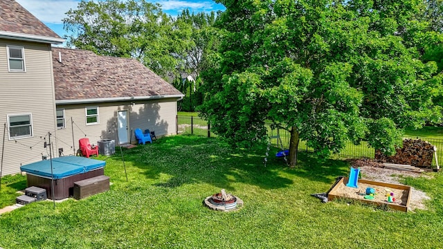 2020 Autumnwood Dr, Ottawa, IL 61350 - fenced backyard with a hot tub and an outdoor fire pit