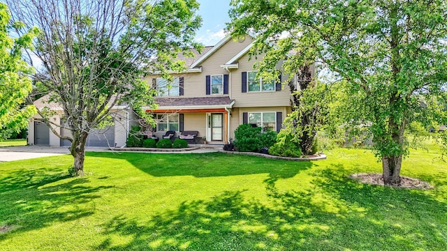 2020 Autumnwood Dr, Ottawa, IL 61350 - view of front facade with a front lawn, concrete driveway, and a porch