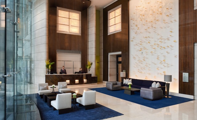 401 N Wabash Ave Unit 35J, Chicago, IL 60611 - building lobby with a high ceiling and wood walls
