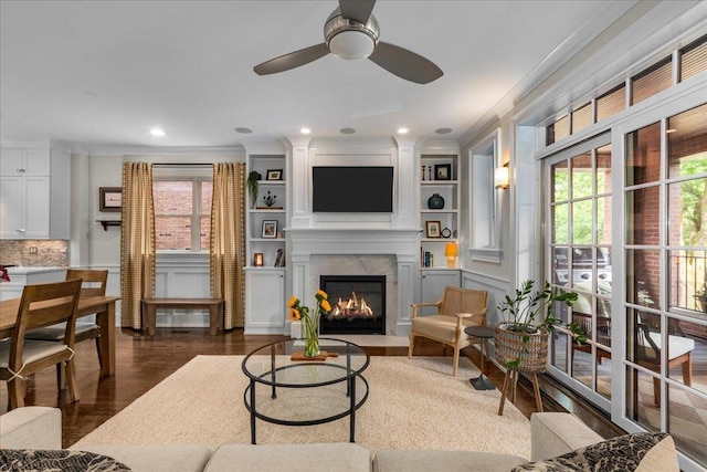 657 W Melrose St Unit 2, Chicago, IL 60657 - living area featuring crown molding, ceiling fan, a high end fireplace, plenty of natural light, and dark wood-type flooring