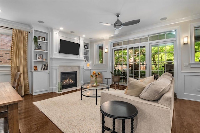 657 W Melrose St Unit 2, Chicago, IL 60657 - living area featuring a ceiling fan, a fireplace with flush hearth, dark wood-style flooring, a decorative wall, and crown molding