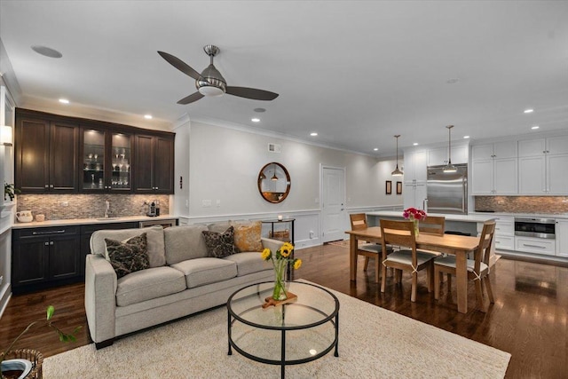 657 W Melrose St Unit 2, Chicago, IL 60657 - living room with ornamental molding, recessed lighting, a ceiling fan, wood finished floors, and wainscoting