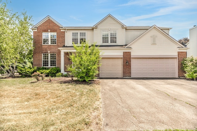 24625 Woodstock Dr, Plainfield, IL 60585 - traditional-style home with driveway and brick siding