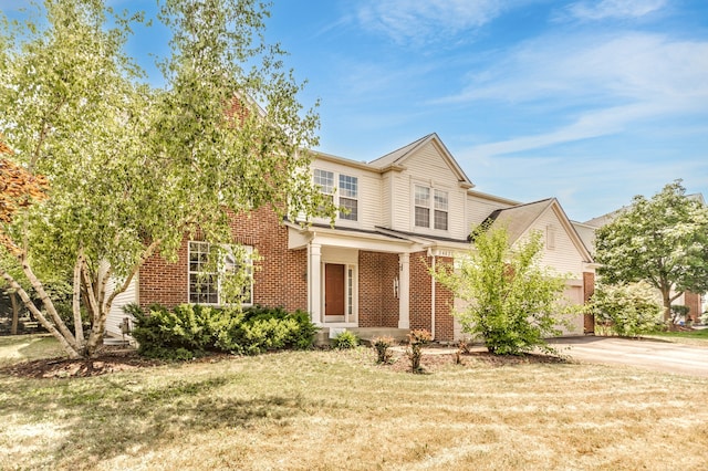 24625 Woodstock Dr, Plainfield, IL 60585 - view of front of home featuring brick siding, driveway, and a front lawn