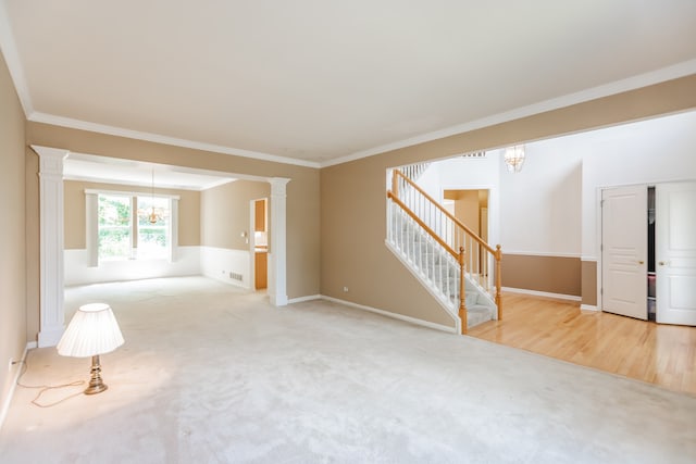 24625 Woodstock Dr, Plainfield, IL 60585 - carpeted spare room featuring a chandelier, stairs, ornamental molding, and ornate columns