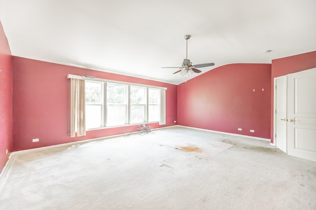 24625 Woodstock Dr, Plainfield, IL 60585 - carpeted empty room featuring vaulted ceiling and ceiling fan