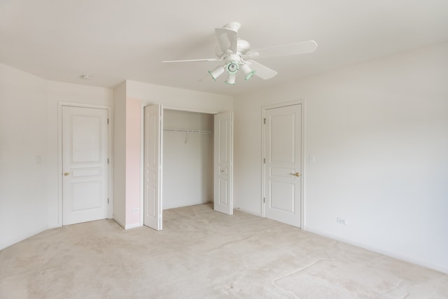 24625 Woodstock Dr, Plainfield, IL 60585 - unfurnished bedroom featuring light carpet, a closet, and ceiling fan