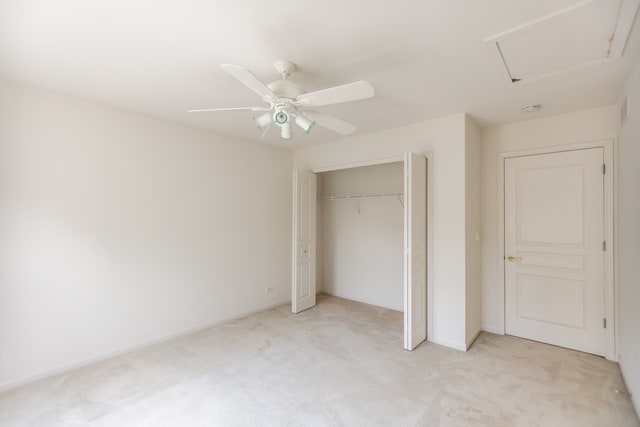 24625 Woodstock Dr, Plainfield, IL 60585 - unfurnished bedroom featuring light colored carpet, a closet, a ceiling fan, and attic access
