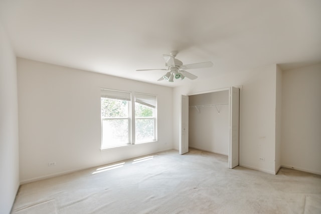 24625 Woodstock Dr, Plainfield, IL 60585 - unfurnished bedroom with light carpet, a closet, and a ceiling fan