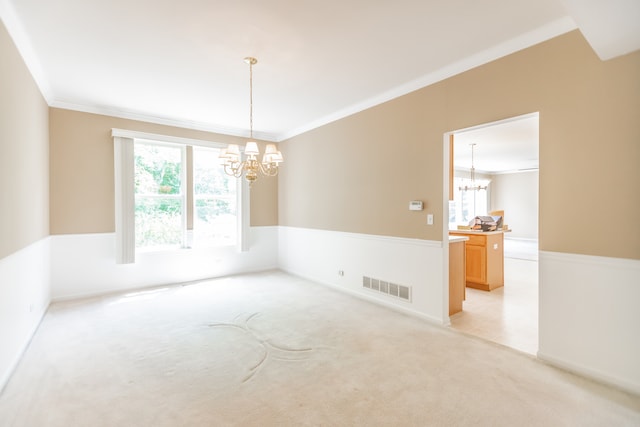 24625 Woodstock Dr, Plainfield, IL 60585 - unfurnished room with a chandelier, ornamental molding, healthy amount of natural light, and light carpet