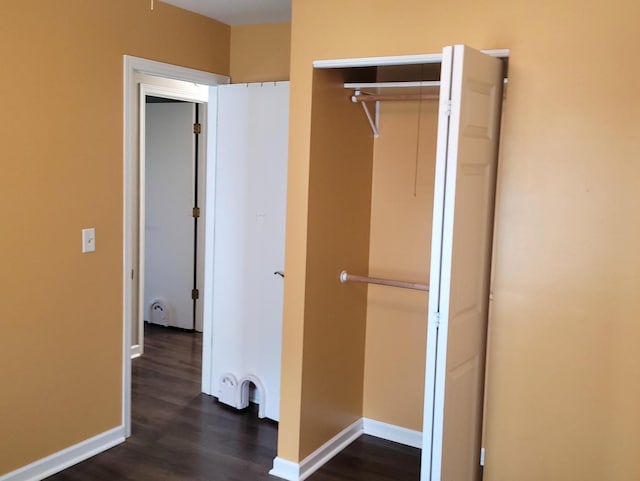 19936 S Spruce Dr, Frankfort, IL 60423 - unfurnished bedroom featuring dark wood-type flooring and a closet