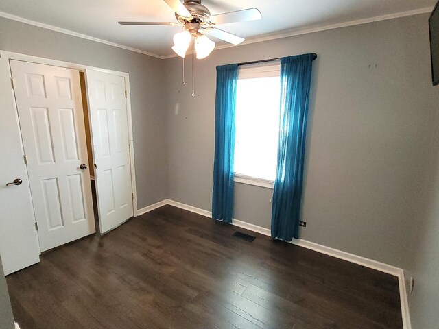 19936 S Spruce Dr, Frankfort, IL 60423 - spare room with dark wood-type flooring, a ceiling fan, and ornamental molding