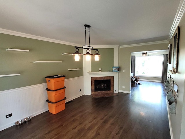 19936 S Spruce Dr, Frankfort, IL 60423 - unfurnished living room featuring dark wood-style floors, crown molding, wainscoting, and a tiled fireplace