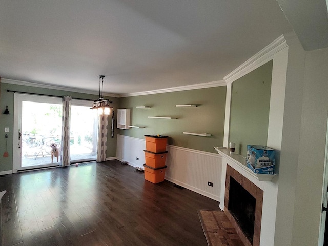 19936 S Spruce Dr, Frankfort, IL 60423 - unfurnished dining area featuring a fireplace with flush hearth, dark wood-type flooring, wainscoting, and crown molding