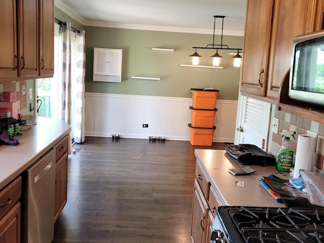 19936 S Spruce Dr, Frankfort, IL 60423 - kitchen with gas range, brown cabinets, wainscoting, dark wood-type flooring, and ornamental molding