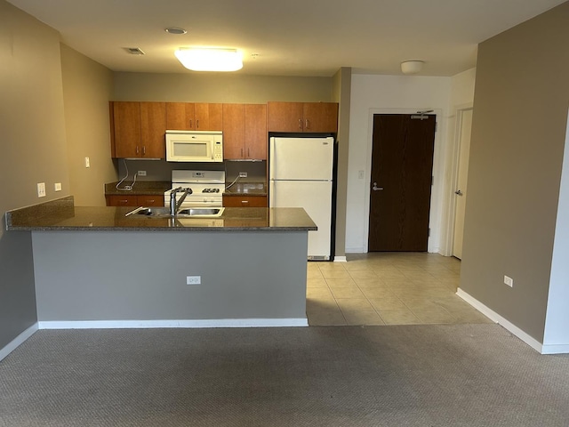 7757 Van Buren St Unit 413, Forest Park, IL 60130 - kitchen featuring white appliances, a peninsula, brown cabinets, and light colored carpet