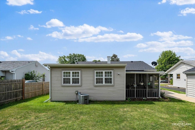 120 Riverside Dr, Montgomery, IL 60538 - rear view of property with a sunroom and a chimney